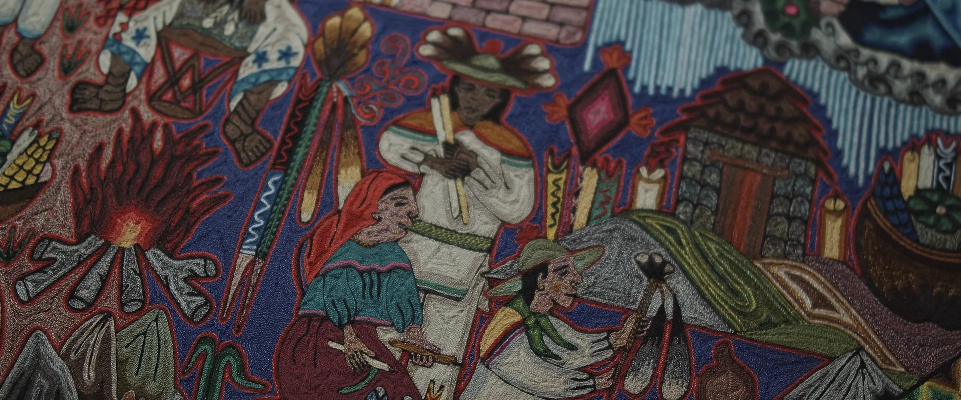 Detail of a Wixárika yarn painting with fire and figures